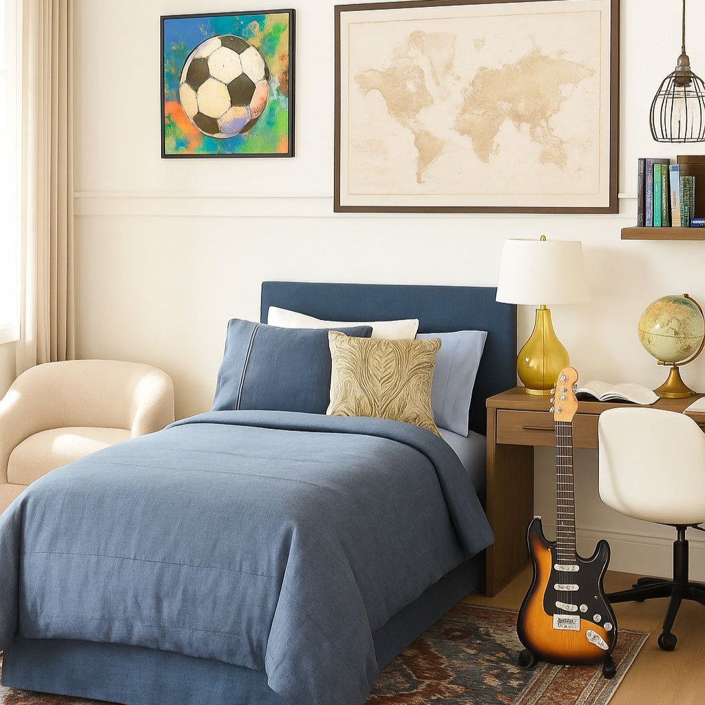 Bedroom with blue bedding, guitar, and world map on wall