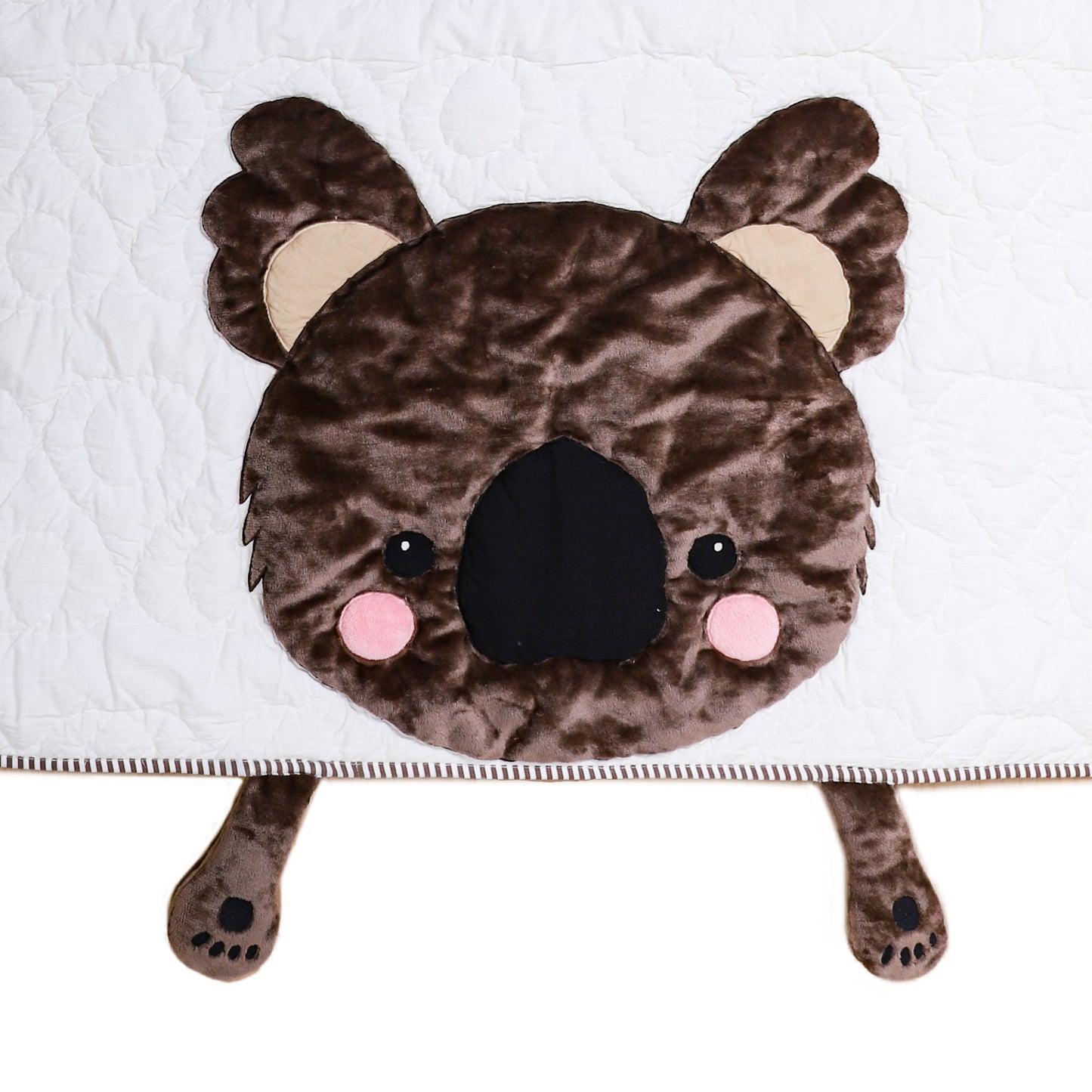 Plush toy shaped like a bear head with a white background