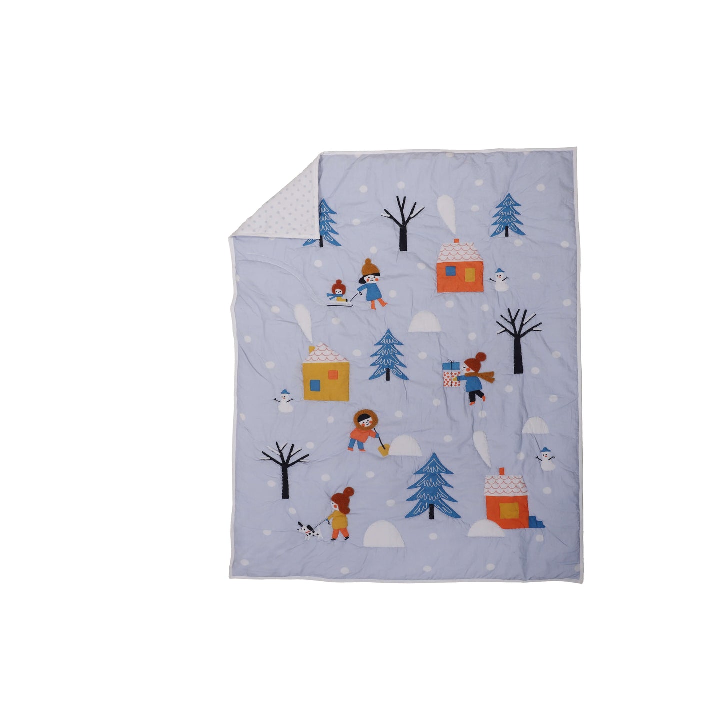 A baby quilt with a winter theme, featuring characters such as a snowman, trees, and possibly a bear, is displayed on a crib.