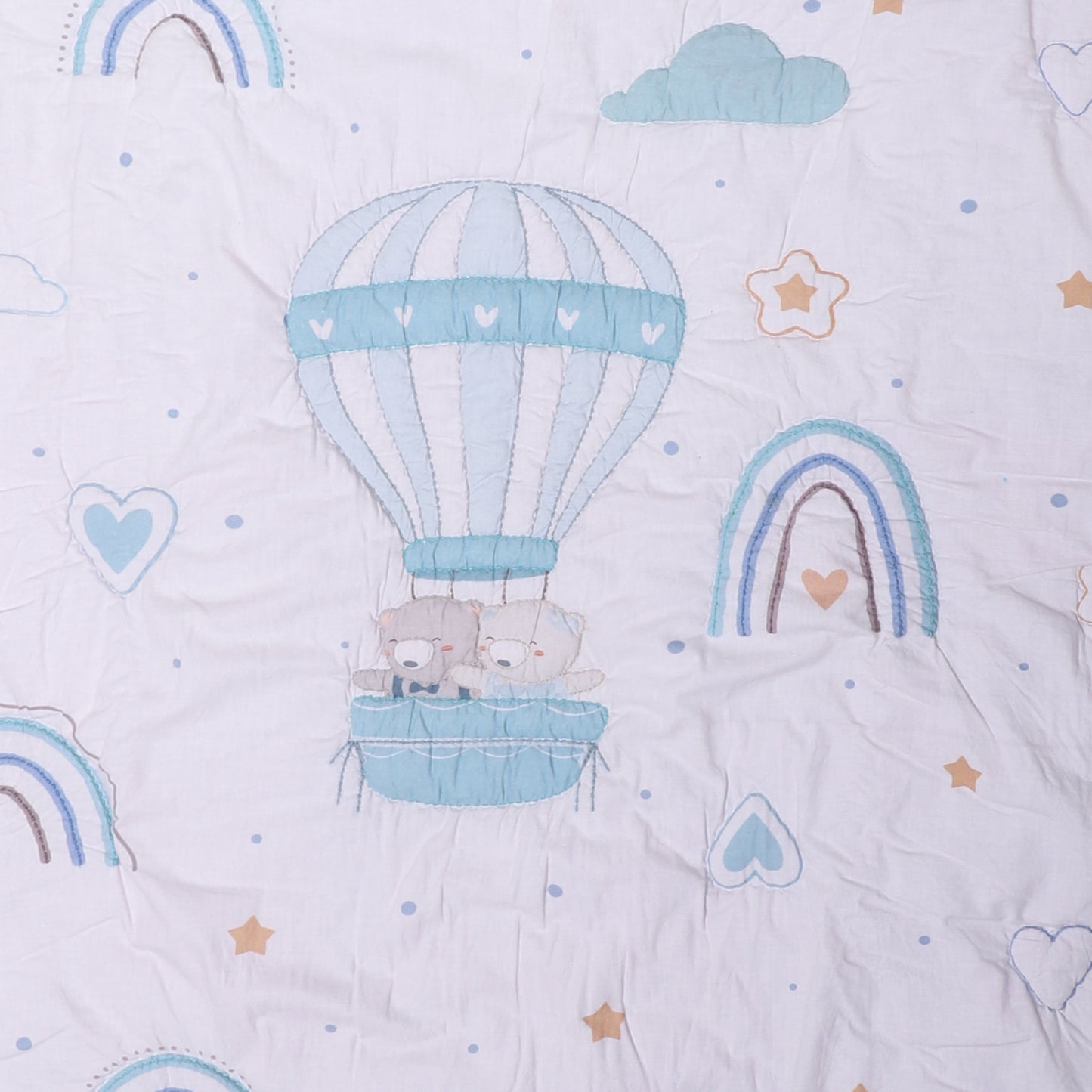Children's fabric with hot air balloon, teddy bears, and rainbow pattern on a light blue background