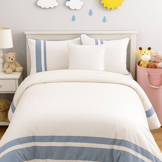 Children's bedroom with striped bedding, toys, and wall decorations.
