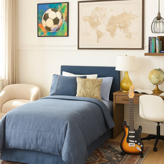 Bedroom with blue bedding, guitar, and world map on wall