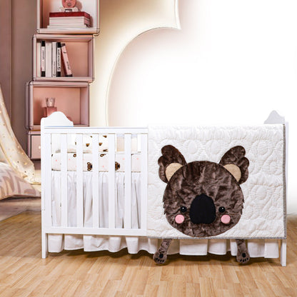 Crib with a bear face design in a nursery setting