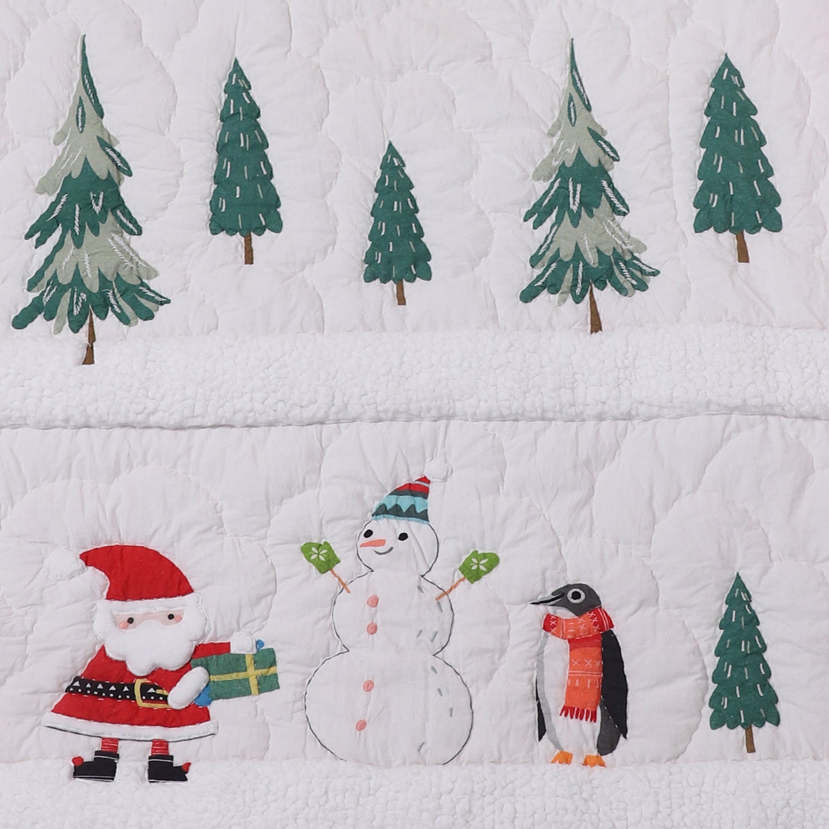 Quilt with Christmas-themed design featuring Santa, snowman, penguin, and trees.