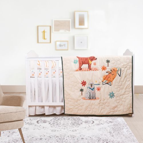 A baby quilt with a puppy design, displayed on a crib in a nursery room.