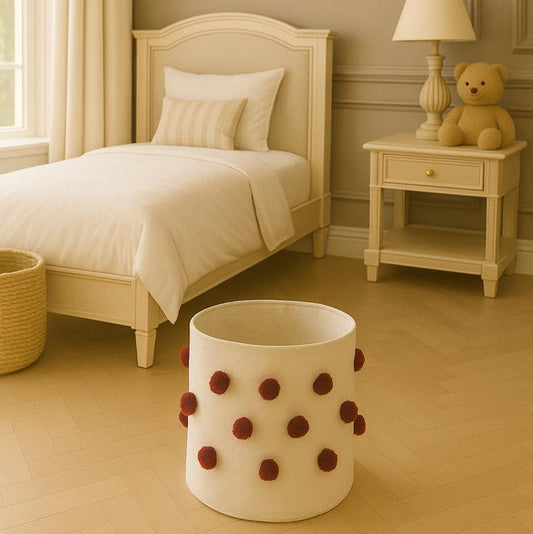 Children's bedroom with a bed, nightstand, lamp, and teddy bear.