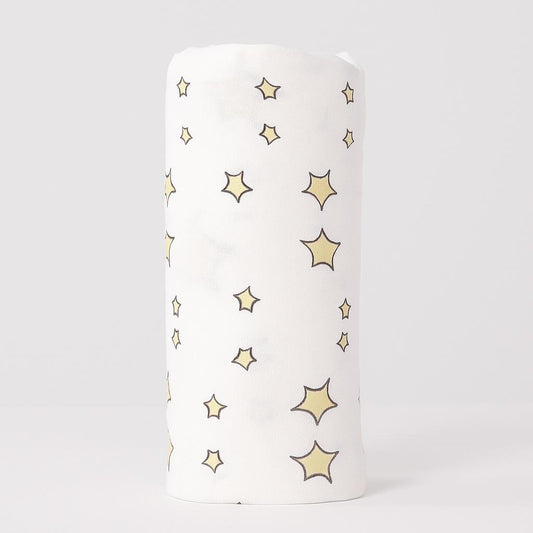 White cylindrical container with star patterns on a light gray background