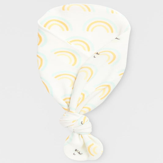 White headscarf with yellow rainbows and cloud patterns on a light gray background