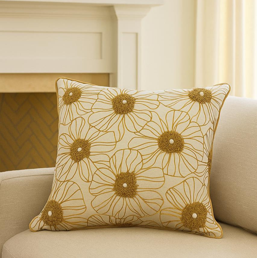 Decorative pillow with floral pattern on a beige sofa
