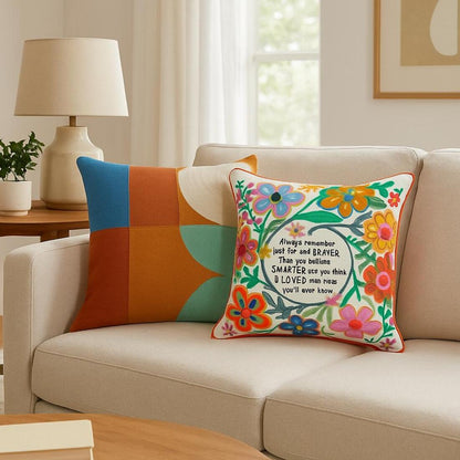 Decorative pillows on a beige sofa in a living room setting