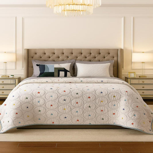 Bedroom with a bed featuring a decorative quilt and pillows.