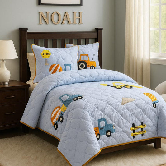 Children's bedroom with construction-themed bedding and decor.