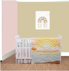 A baby quilt with a colorful design featuring sun motifs and clouds, displayed in a nursery room.