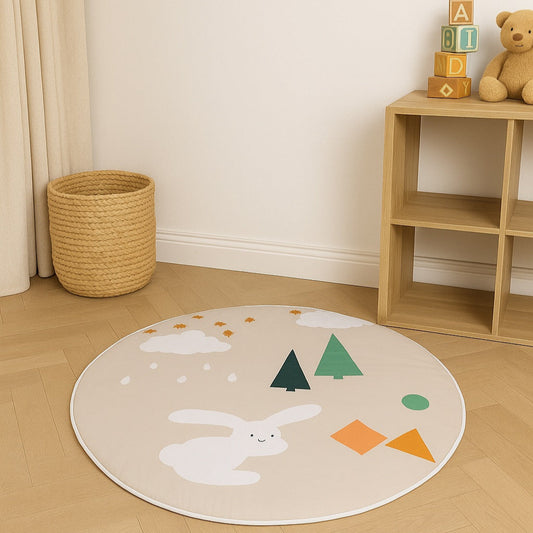 Round children's rug with rabbit and tree design on a wooden floor, with toys and a basket in the background.